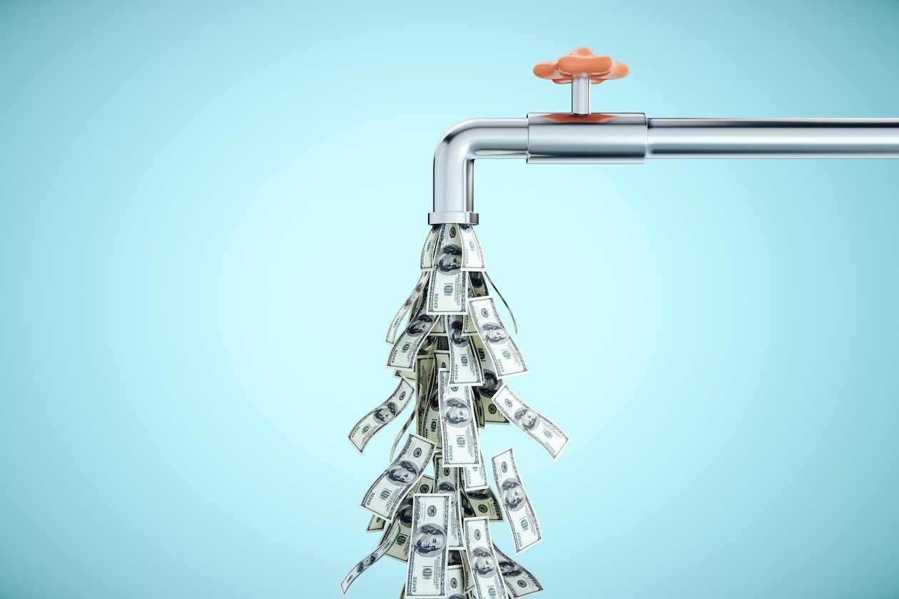 Flowing dollar banknotes from a water tap, representing improved cash flow and steady revenue growth with better business systems.