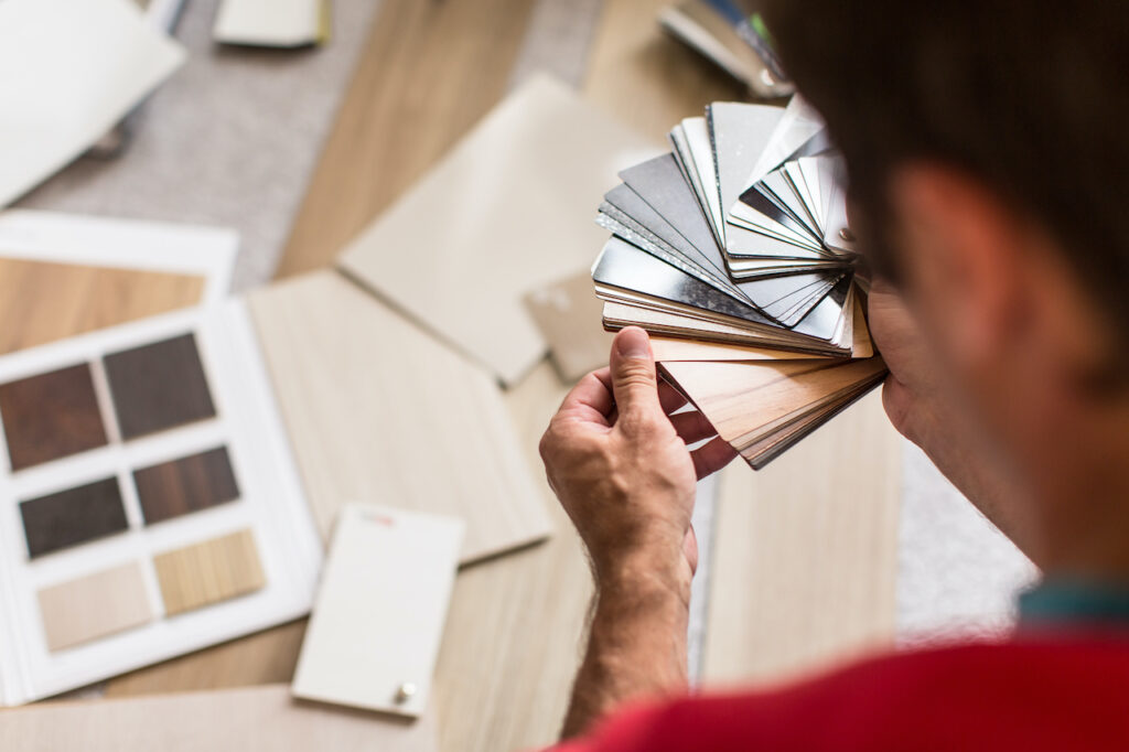 Man choosing the right flooring for his house
