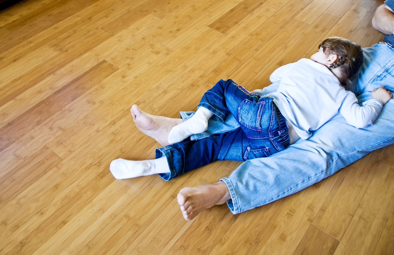 Family laying on Bamboo flooring
