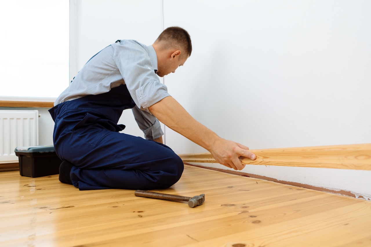 Installing light colored baseboard