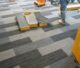 Commercial office space with newly installed gray carpet flooring, showing clean and professional finish.